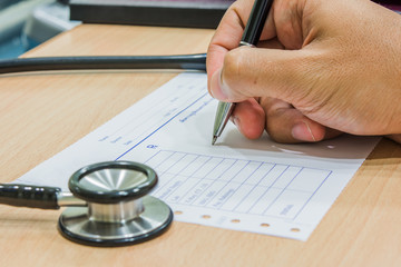 A person reviewing a petition beside a stethoscope
