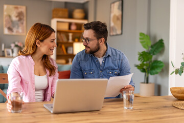 A family reviewing support information together at a table